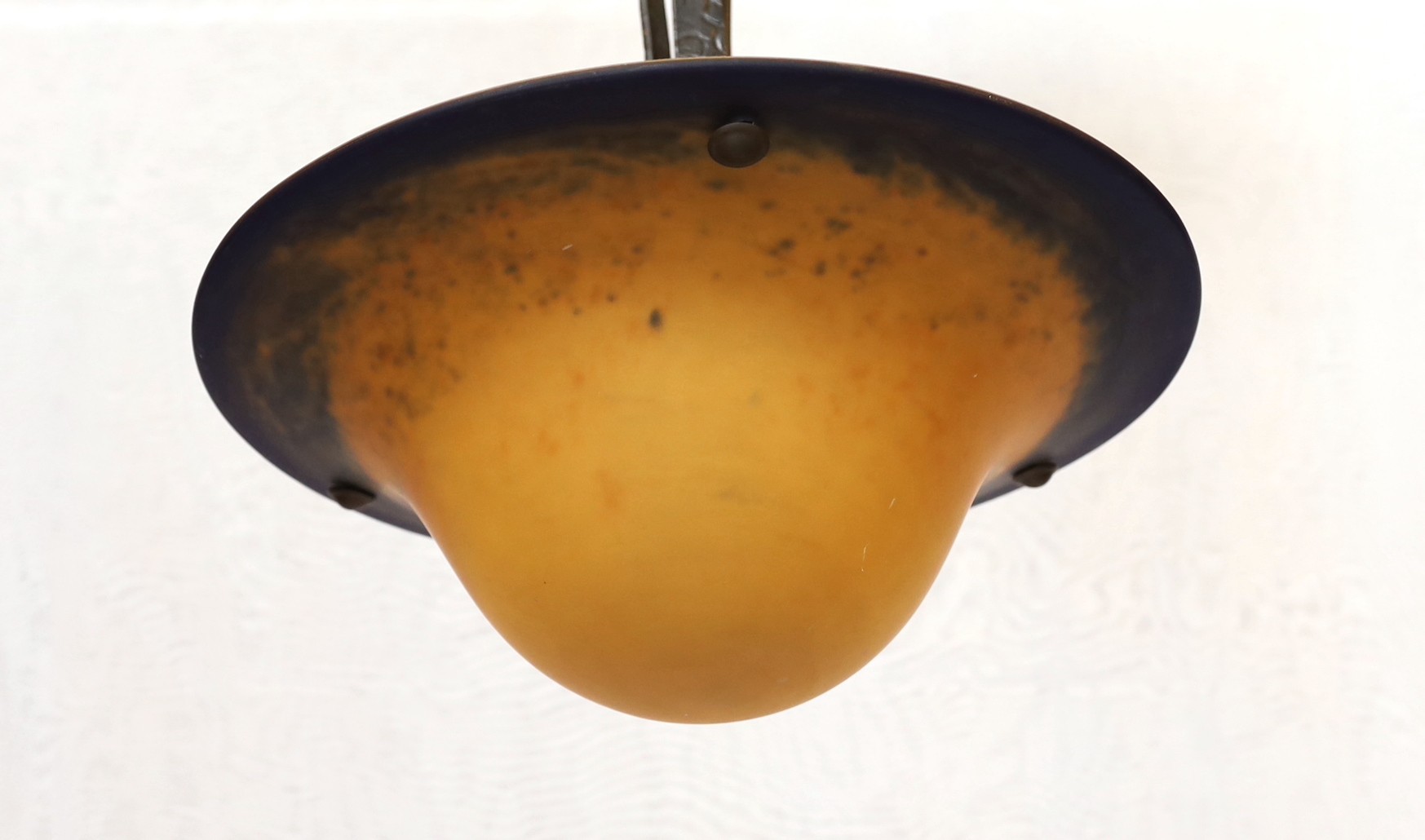 A 1920s–30s French wrought iron and marbled glass light fitting with rose motifs, drop 70cm. width 40cm